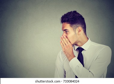 Business Man Whispering A Gossip Secret To Someone Isolated On Gray Background