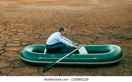 Business Man Will Row Home For Shore In Paddle Powered Row Boat.businessman Rock Look Bright Future Symbol Crisis Stagnation Losses Braking Difficulties Environmental Disaster Water Scarcity Drought