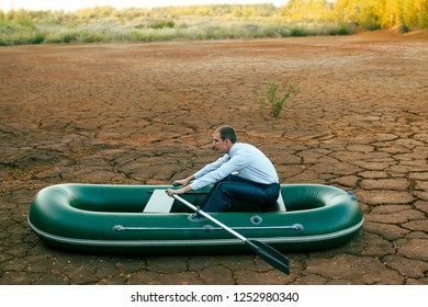 Business Man Will Row Home For Shore In Paddle Powered Row Boat.businessman Rock Look Bright Future Symbol Crisis Stagnation Losses Braking Difficulties Environmental Disaster Water Scarcity Drought