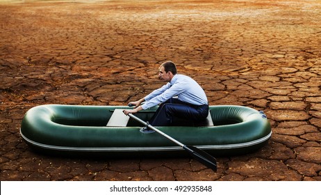 Business Man Will Rows Home For Shore In Paddle Powered Row Boat Businessman In Boat Rocks Looks Bright Future Symbol Crisis Stagnation Losses Braking Environmental Disaster Water Scarcity Drought