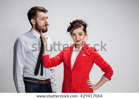 The business man and woman communicating on a gray background