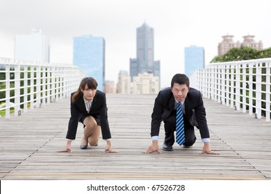 Business Man And Woman  Getting Ready For Race In Business