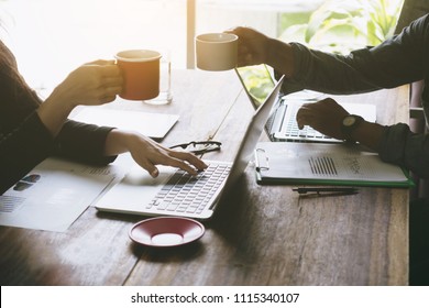  Business man and woman have a meeting and clink glasses of coffee in 
Office. - Powered by Shutterstock