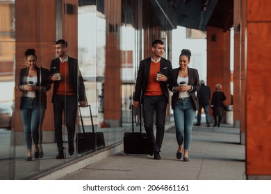 Business man and business woman talking and holding luggage traveling on a business trip