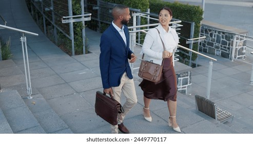 Business man, woman and talking in street on commute to work in metro with discussion, chat and walking. People, staff and employees with bag, outdoor and conversation for travel on metro sidewalk - Powered by Shutterstock