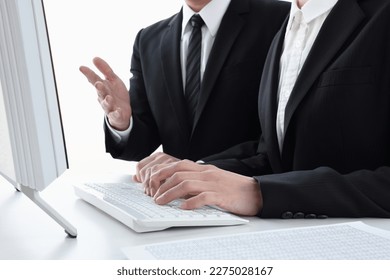 Business man and woman working together in office - Shutterstock ID 2275028167