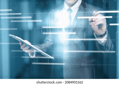 Business Man Work With A Project Schedule Plan On A Virtual Computer Screen.