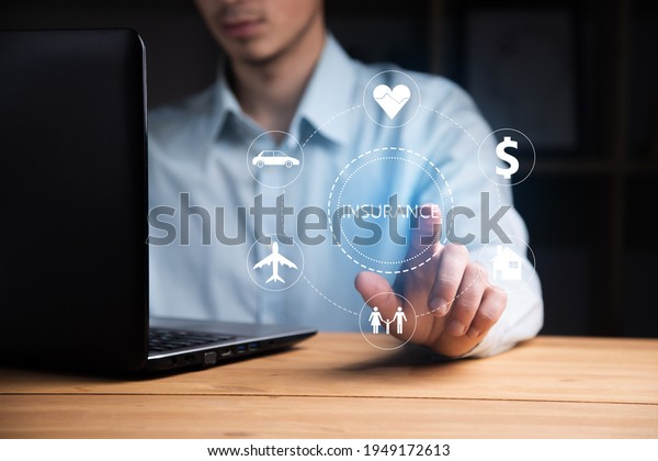 business man\
working computer with insurance\
icon