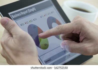 business man working on digital tablet at office - Shutterstock ID 162752150