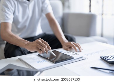 Business man working on digital tablet Graphic designer drawing on graphic tablet creative studying work at home - Powered by Shutterstock