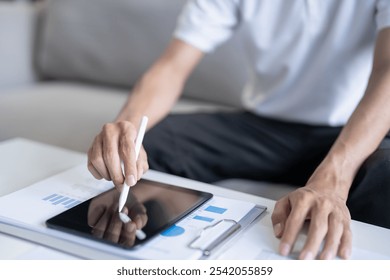 Business man working on digital tablet Graphic designer drawing on graphic tablet creative studying work at home - Powered by Shutterstock