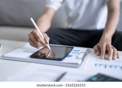 Business man working on digital tablet Graphic designer drawing on graphic tablet creative studying work at home - Powered by Shutterstock