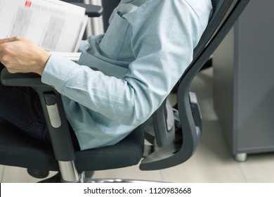 Business Man Working On His Computer In An Ergonomic Office Chair