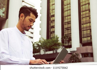Business man working outdoor and offices building background. - Shutterstock ID 1119273062
