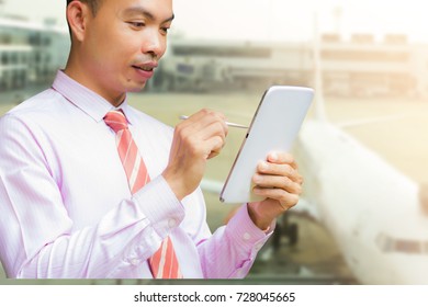Business Man Is Working With Tablet In Airport