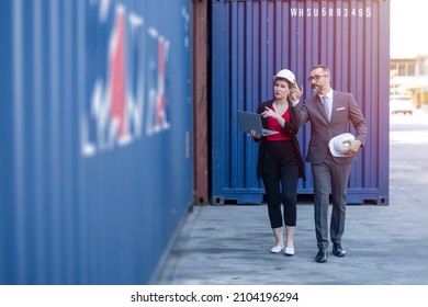 Business man working with women team or secretary in port cargo logistics industry - Shutterstock ID 2104196294