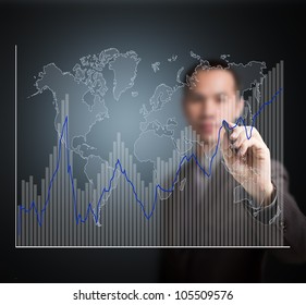 business man writing fluctuate upward trend graph with world map