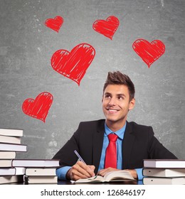 Business Man Writing A Love Letter At His Office Desk