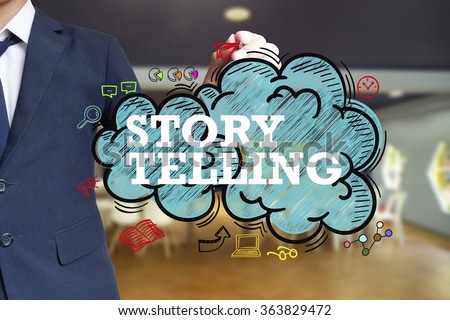 business man writing STORY TELLING over the cloud with office background , business concept , business idea