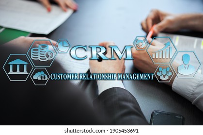 Business management concept - group of businessmen in office with digital business icons, graphic banner showing symbol of banking, commercial assistance. Inscription: CRM
