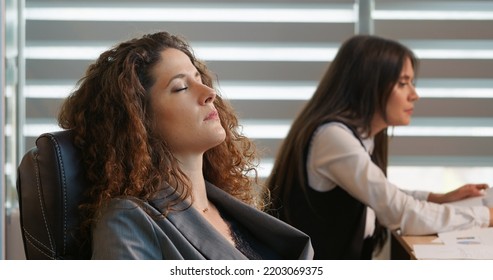 Business Manager Lying On Her Back Tired Of Working Relaxing In Office. Female Finishing Task Taking A Break At Workplace.