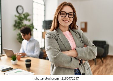 Business manager smiling happy with arms crossed gesture. Employee working at the office. - Shutterstock ID 2180471657