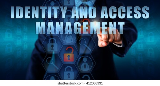 Business Manager Is Touching IDENTITY AND ACCESS MANAGEMENT On An Interactive Visual Screen. Information Technology Security Concept For Management Of Access Rights Identification Processes.