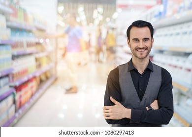 Business MAN,Owner Of The Convenience Store,  Smiles Patiently,Welcomes Customers To Buy In The Shop.