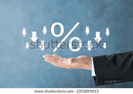 Business man's hand and percent sign with upward arrows
