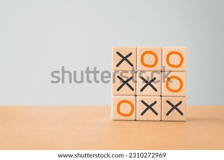 Business marketing strategy planning concept. Wooden block tic tac toe board game including copy space