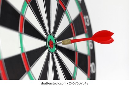 Business marketing success concept. The red dart arrow bullseye in the middle of the dart paper is the goal of the business. - Powered by Shutterstock