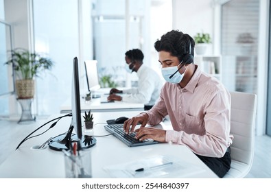 Business, mask and telemarketing with man, customer service and computer with headphones. Face cover, employee and agent for help desk, consulting and policy for safety, tech support and call center - Powered by Shutterstock