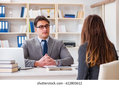 Business meeting between businessman and businesswoman - Shutterstock ID 612803612