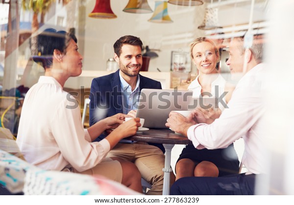 Business meeting in a\
cafe