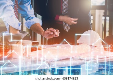 BUSINESS MEETING AND CONSULTING CONCEPT WITH PEOPLE ENGINEER AND ARCHITECT with graphic of building shape line ideas - Shutterstock ID 659174923