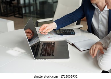 Business Meeting In The Office Working With Laptop And Papers, No Face, Warm Color