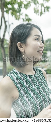 Business meeting outdoor, young business woman holding cup of coffee.