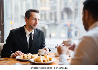 Business Meeting of Partners in Cafe