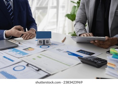 Business meeting of real estate brokers Businesses working with new startup projects Marketing concept presentation analysis plan Close-up pictures