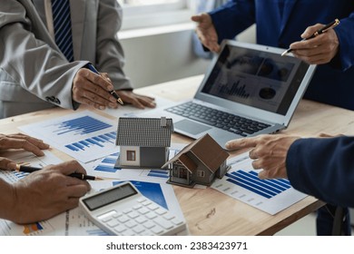 Business meeting of real estate brokers Businesses working with new startup projects Marketing concept presentation analysis plan Close-up pictures