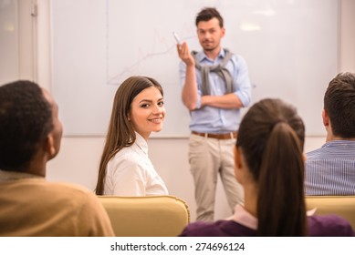 Business meeting. Teamwork concept. Young businessman with speech to colleagues.