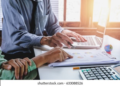 Business meeting time. Photo young account managers crew working with new startup project. Notebook on wood table. Idea presentation, analyze plans. - Shutterstock ID 633088526