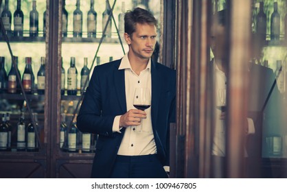 Business men in bar with wine relaxing after heard working - Shutterstock ID 1009467805