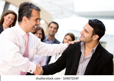 Business Men Closing Deal With A Handshake