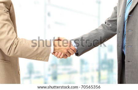 Business men hand shake in the office