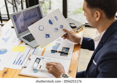 Business Men Are Looking At The Company's Financial Documents To Analyze Problems And Find Solutions Before Bringing The Information To A Meeting With A Partner. Financial Concept.