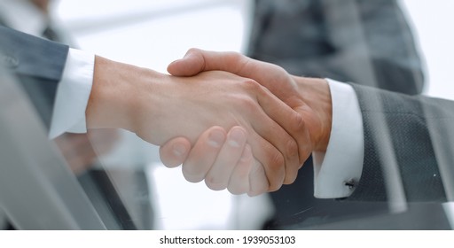 Business men shaking hands. Closeup.