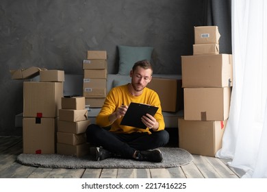 Business Men Sit On Floor Checking Customer Order Online Shipping Boxes At Home. Starting Small Business Entrepreneur SME Freelance. Online Business, Work At Home Concept.