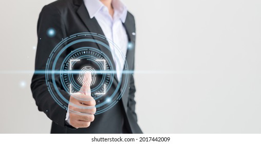 Business men use their thumbs to touch Fingerprint scanning system. Fingerprint scanner technology to verify identity.tif