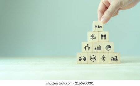 Business mergers and acquisitions concept. Share acquisition, asset business acquisition, amalgamation. Business review and development model. The abbreviation M and A on smart background, copy space.